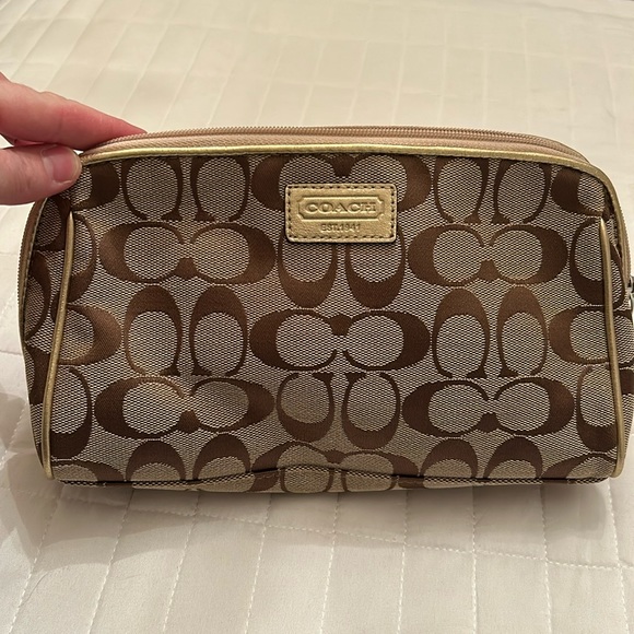 Coach make up bag. Tan canvas with gold coach tag and piping Pink interior. NWOT - Picture 1 of 7